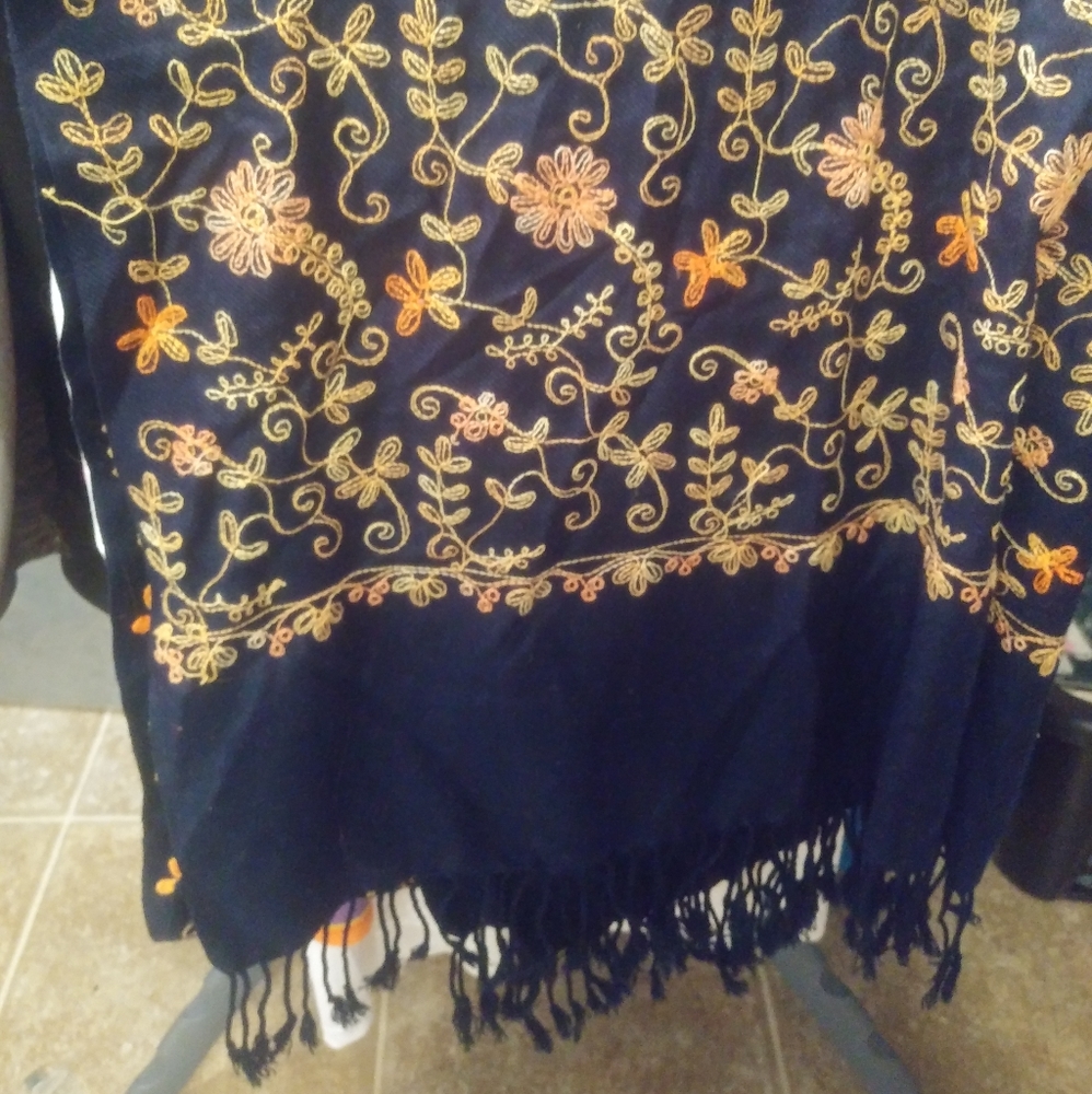 Embroidered shawl.